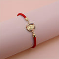 Pulsera Virgen Maria - Cordon Ajustable Banado en Oro 24K — calidad artesanal y devocion autentica