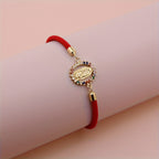 Pulsera Virgen Maria - Cordon Ajustable Banado en Oro 24K — calidad artesanal y devocion autentica