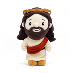Peluche de Jesús con corona dorada y banda terracota — vista completa